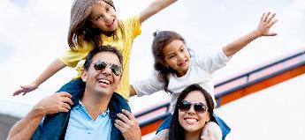 An excited family preps to board an airplane
